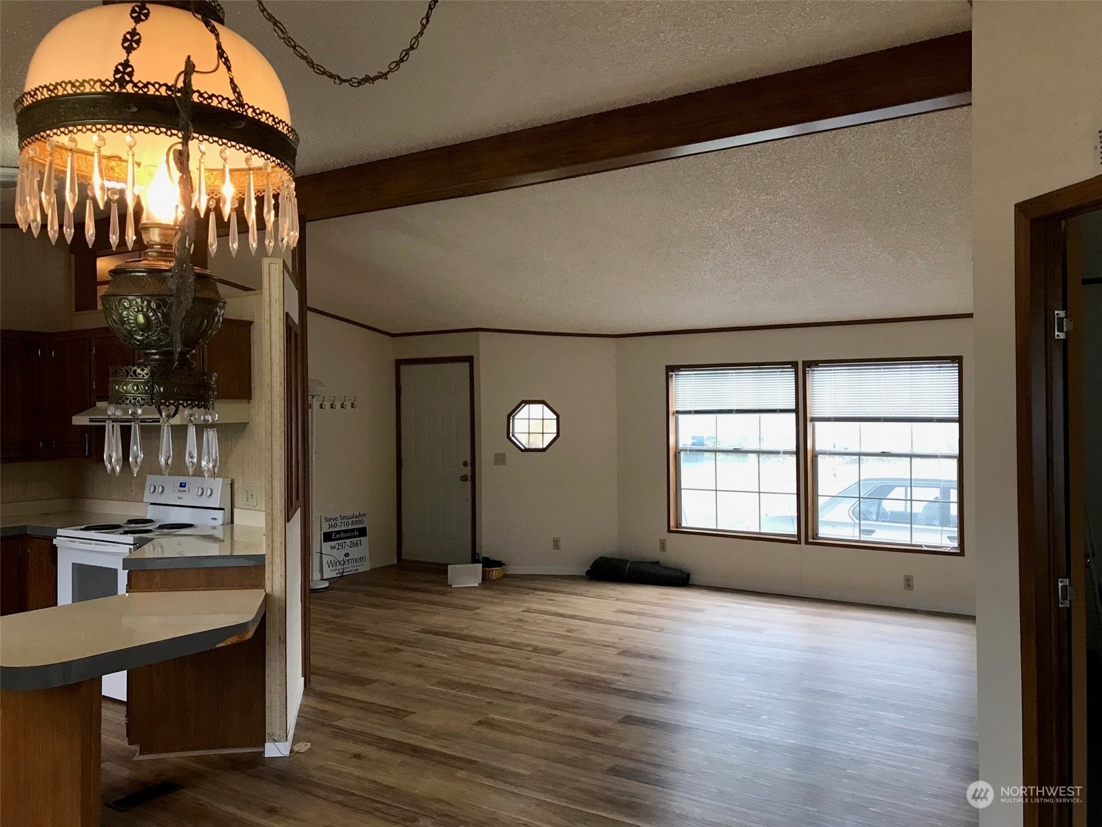 600 Northeast Lincoln Road, Unit 30 Poulsbo, WA 98370 - Photo 5 of 14 a view of a big room with wooden floor and windows