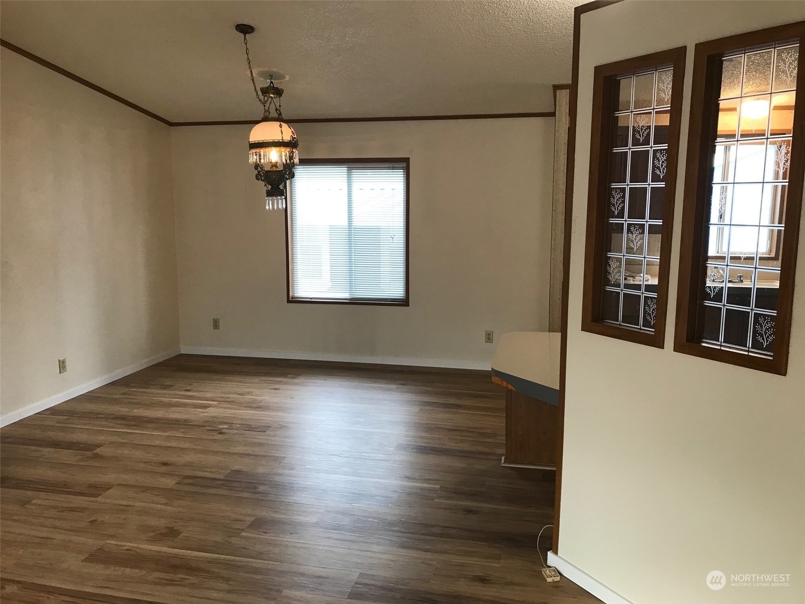 600 Northeast Lincoln Road, Unit 30 Poulsbo, WA 98370 - Photo 6 of 14 an empty room with wooden floor and windows