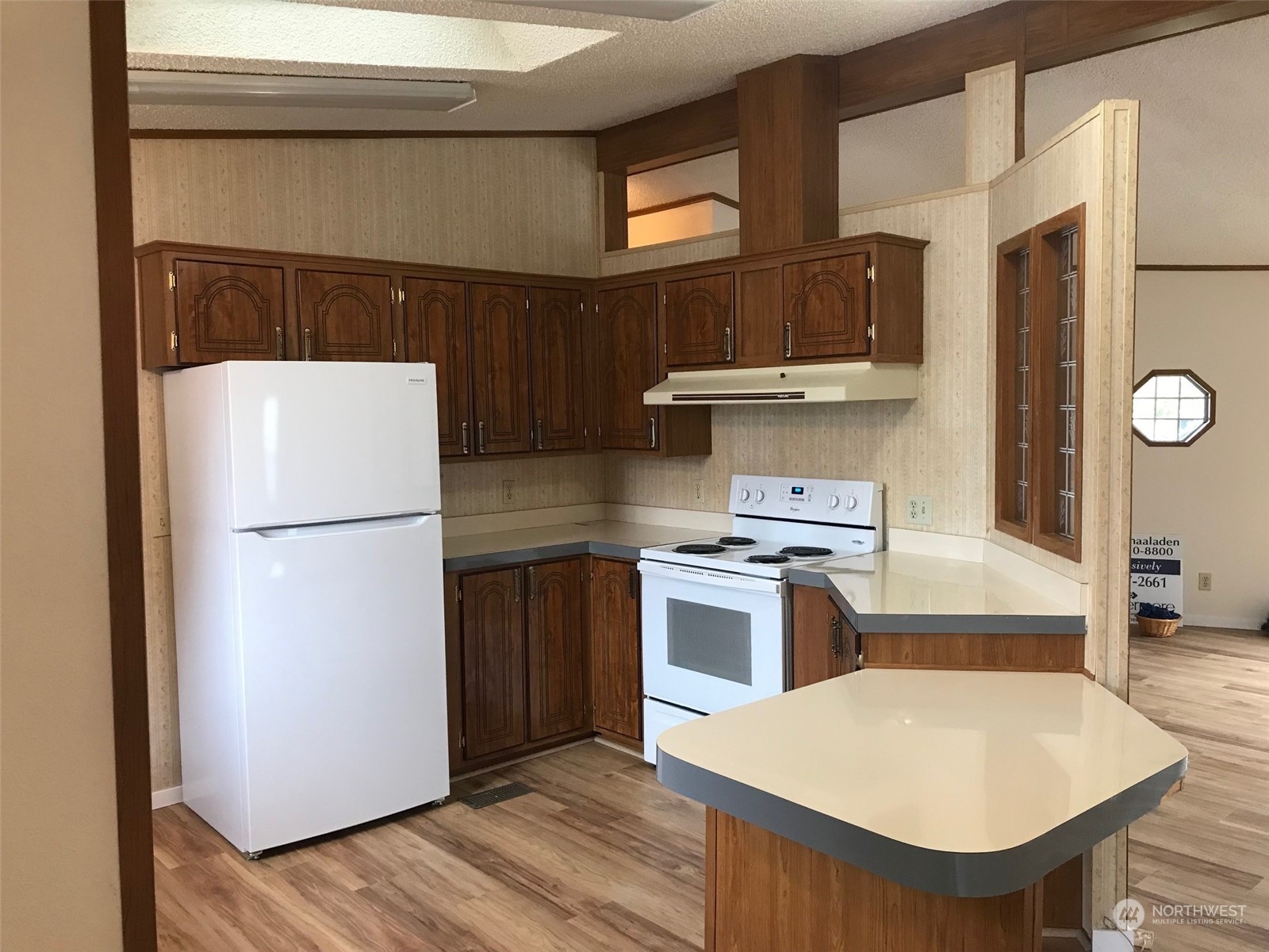 600 Northeast Lincoln Road, Unit 30 Poulsbo, WA 98370 - Photo 7 of 14 a kitchen with a refrigerator and a stove