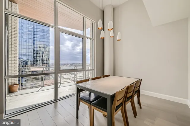a kitchen with stainless steel appliances kitchen island granite countertop a refrigerator and a sink