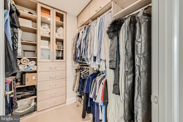 a bedroom with a bed chair and window