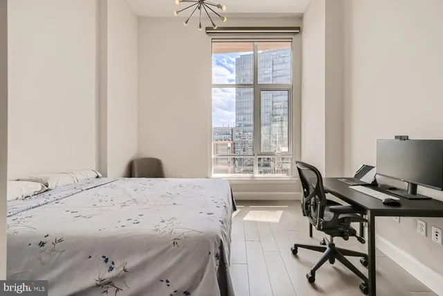 a bathroom with a granite countertop double vanity sink and mirror