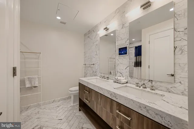 a view of a hallway with washer and dryer