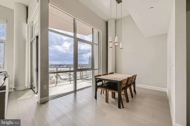 a view of a dining room with furniture and a table