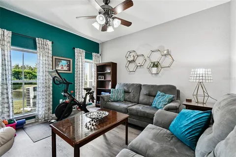 a living room with furniture and a large window