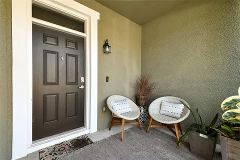 a view of a hallway with chairs