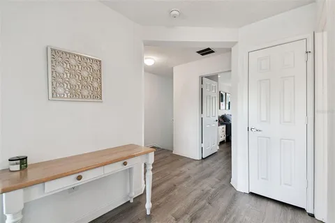 a view of room with hardwood floor and window