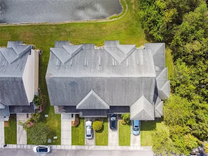 an aerial view of a house having swimming pool