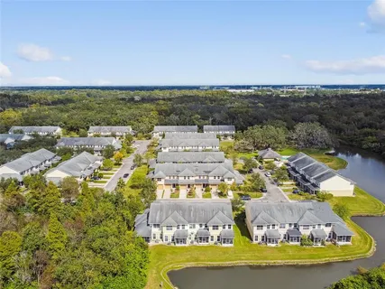 an aerial view of a house with a lake view