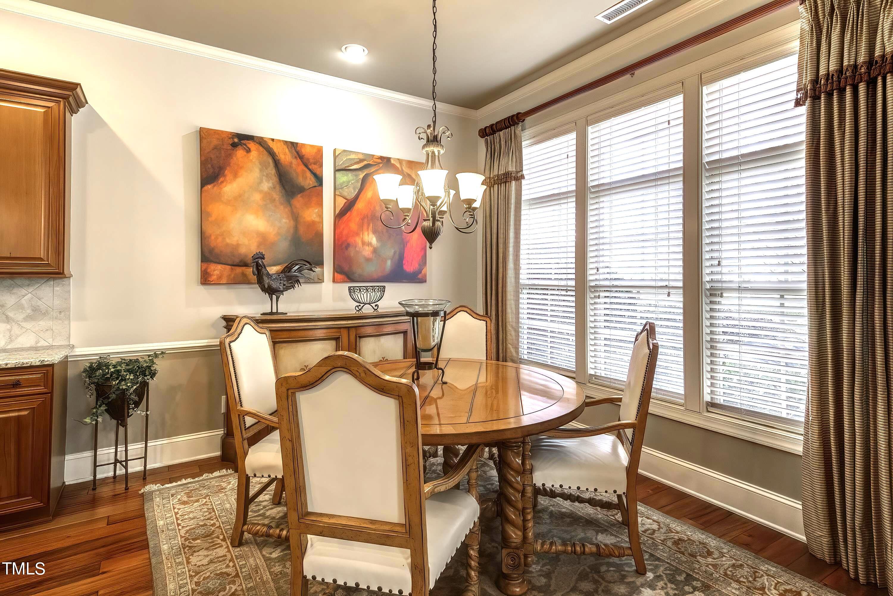 133 Sunstone Drive Cary, NC 27519 - Photo 14 of 37 a view of a dining room with furniture window and outside view