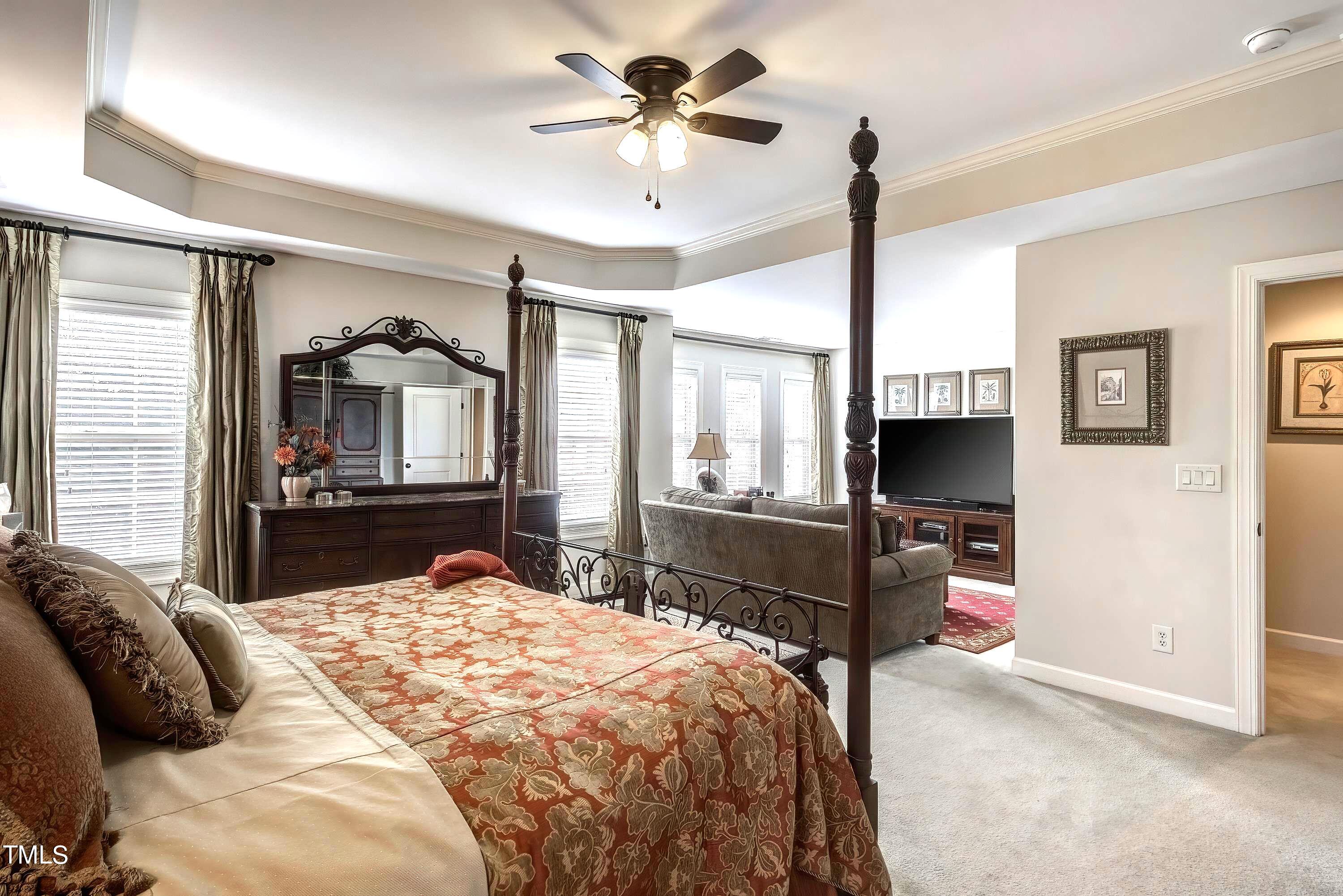 133 Sunstone Drive Cary, NC 27519 - Photo 21 of 37 a bedroom with a bed and a flat screen tv