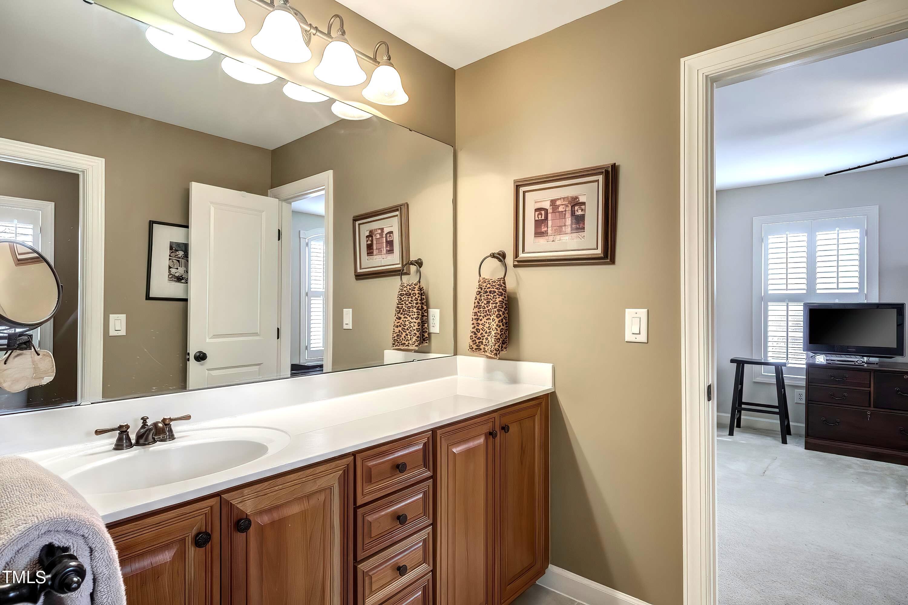 133 Sunstone Drive Cary, NC 27519 - Photo 27 of 37 a bathroom with a sink double vanity and a mirror