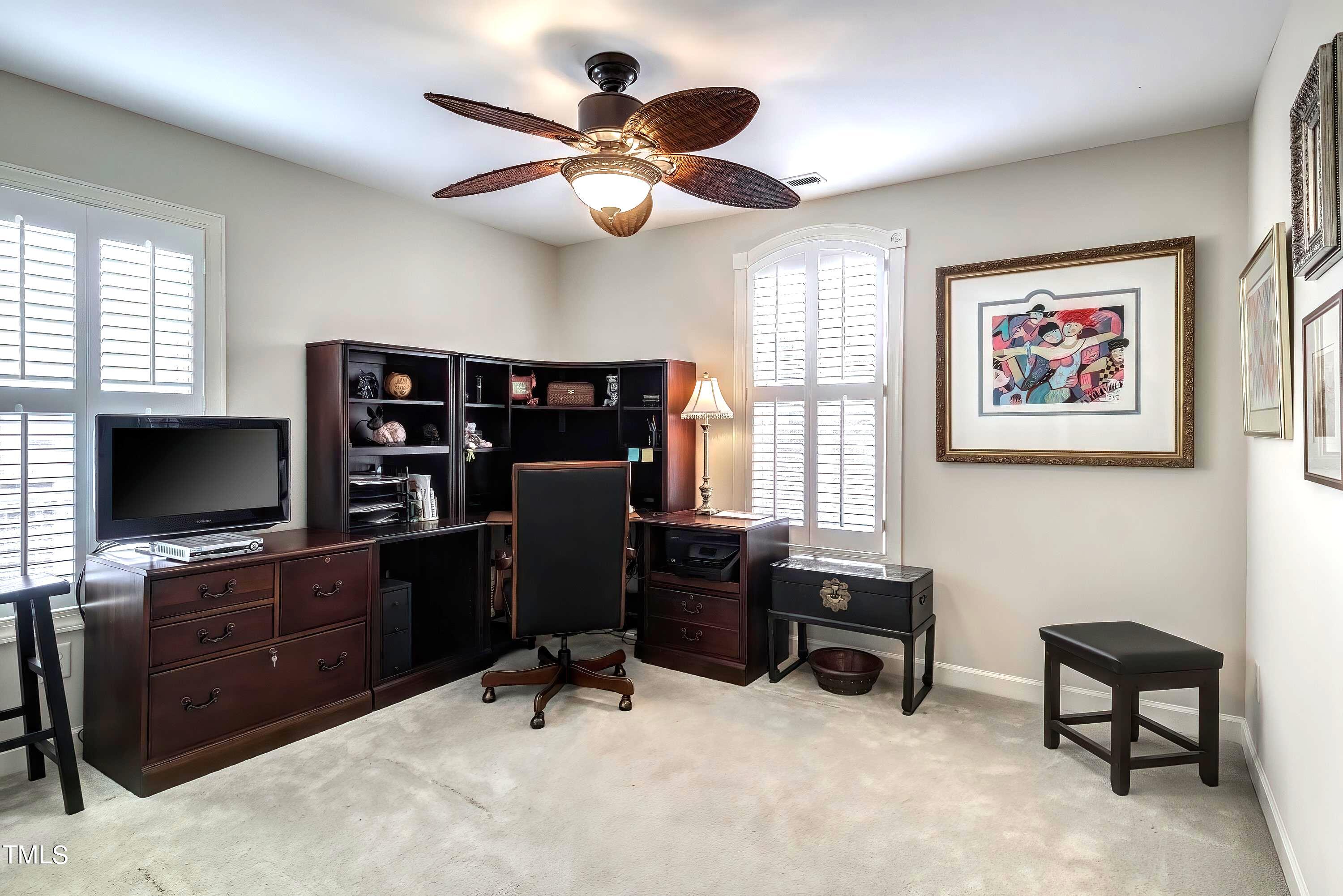 133 Sunstone Drive Cary, NC 27519 - Photo 29 of 37 a view of a livingroom with workspace and a window