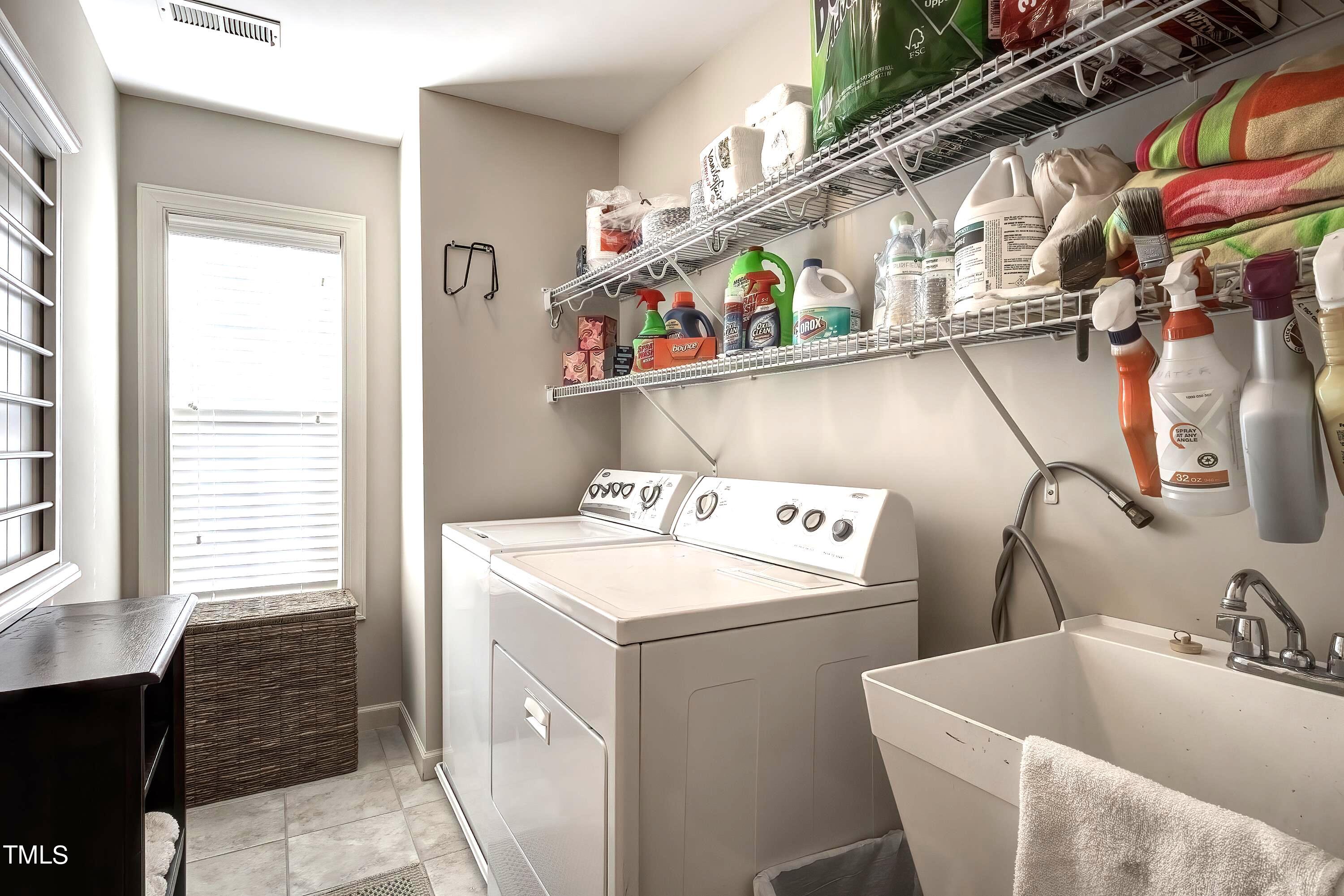 133 Sunstone Drive Cary, NC 27519 - Photo 32 of 37 a utility room with dryer and washer