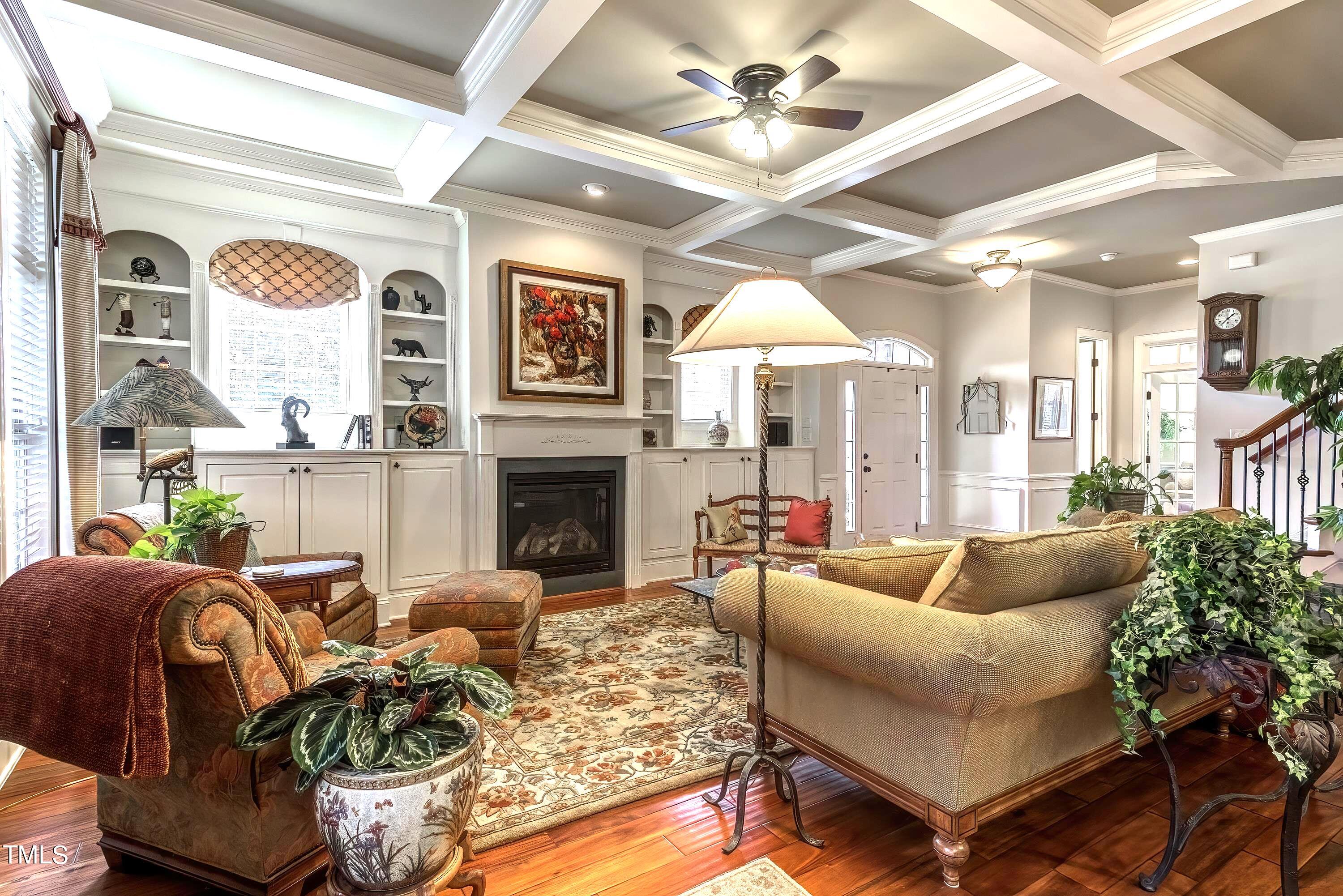 133 Sunstone Drive Cary, NC 27519 - Photo 8 of 37 a living room with furniture a fireplace and a large window