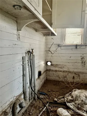a bathroom with a mirror and a shower
