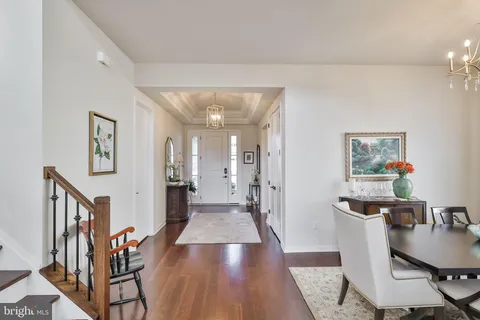 a living room with furniture kitchen view and a fireplace