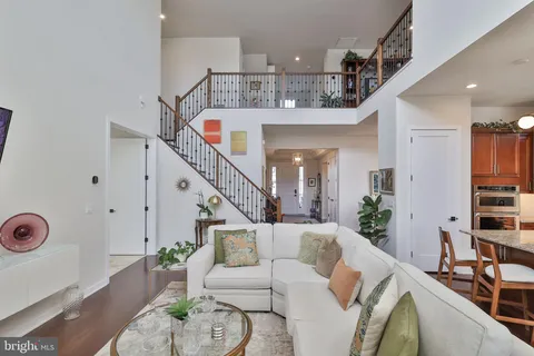 a view of a balcony with furniture and wooden floor