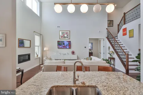 a front view of a house with garden and patio