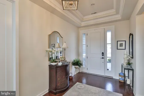 a living room with furniture and a walk in closet