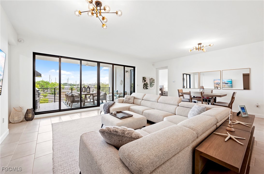 1125 Central Avenue, Unit 463 Naples, FL 34102 - Photo 2 of 42 a living room with furniture and a large window