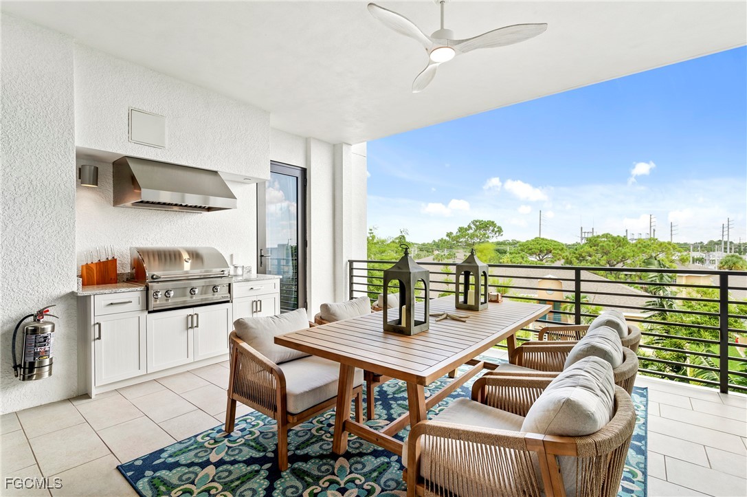 1125 Central Avenue, Unit 463 Naples, FL 34102 - Photo 26 of 42 a dining room with furniture and a floor to ceiling window