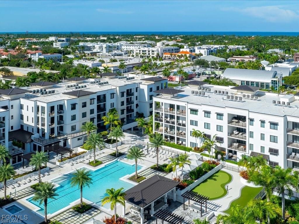 1125 Central Avenue, Unit 463 Naples, FL 34102 - Photo 32 of 42 a view of building with outdoor space and seating space