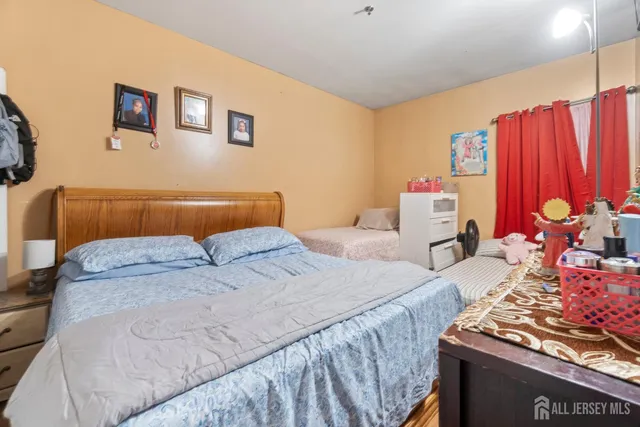 a bedroom with bed and a window