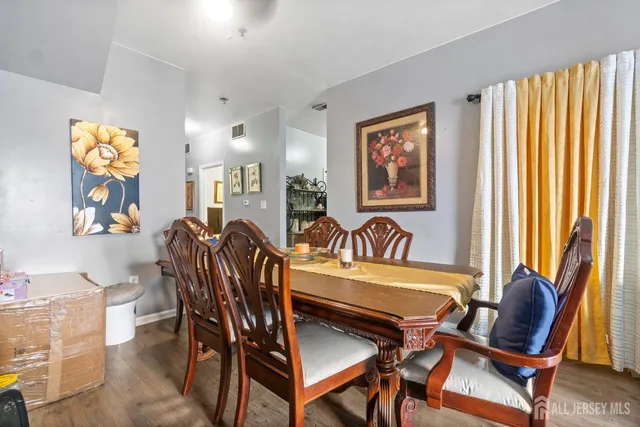 a view of a dining room with furniture and window
