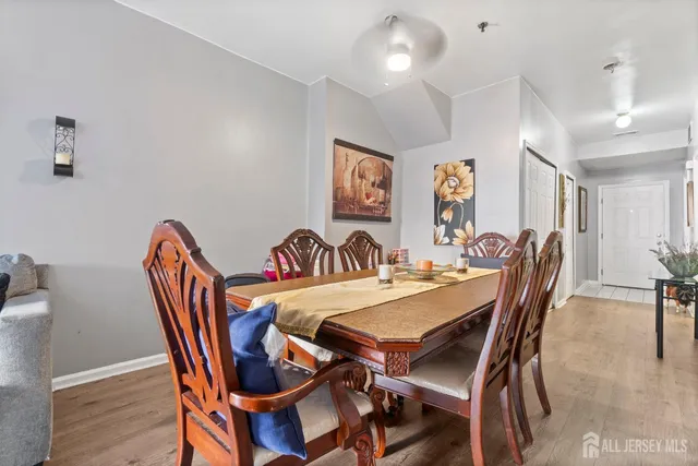 a view of a dining room that has a table and chairs