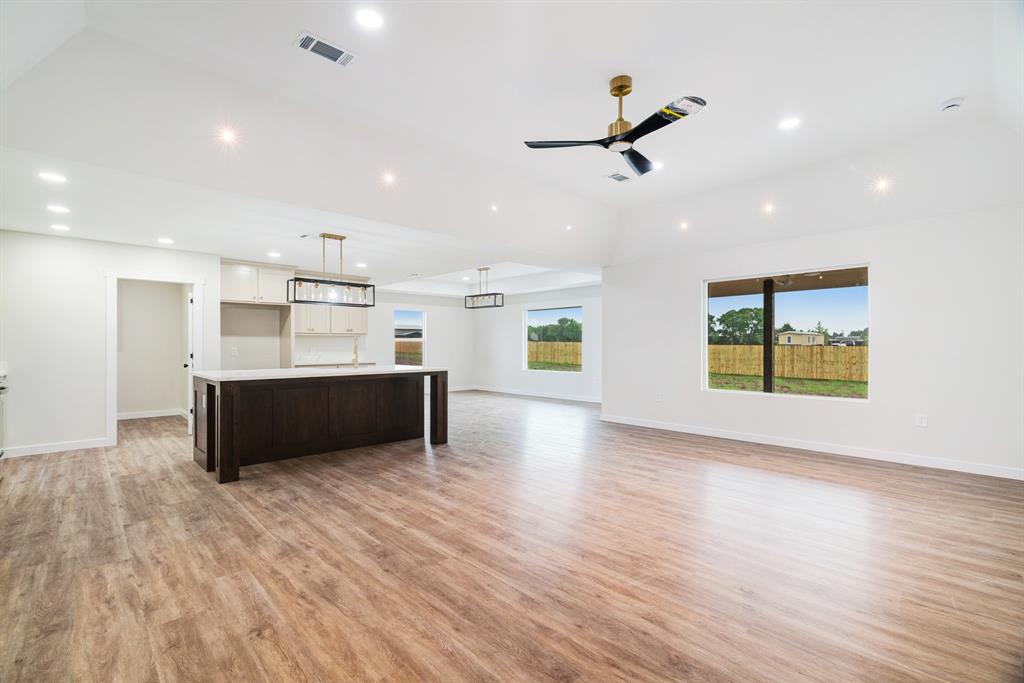59 Private Road Brookston, TX 75421 - Photo 4 of 26 a living room with stainless steel appliances kitchen island wooden floors and living room view
