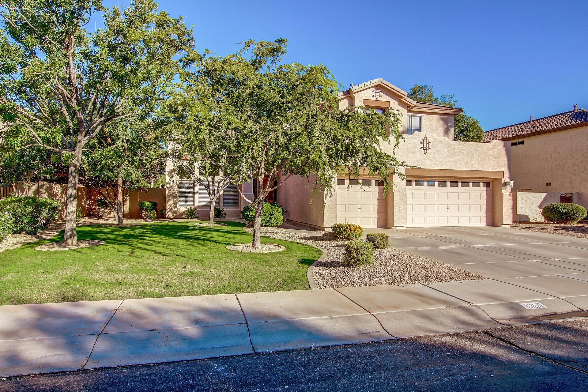 1360 East Harrison Street Gilbert, AZ 85295 - Photo 1 of 34 a front view of a house with a yard