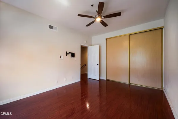 a view of room with window and ceiling fan