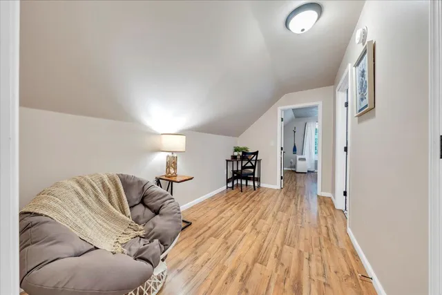 a spacious bedroom with a bed and couch