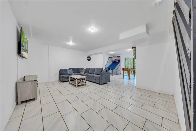 a living room with furniture and a rug