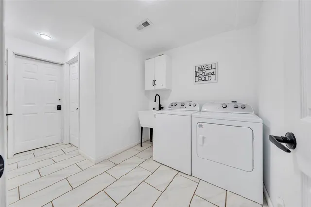 a room with a sink and a mirror