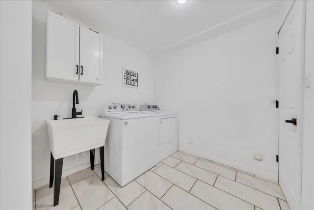 a bathroom with a toilet a sink and a mirror