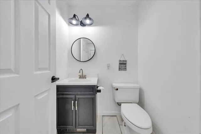 a view of a backyard with wooden fence and a backyard