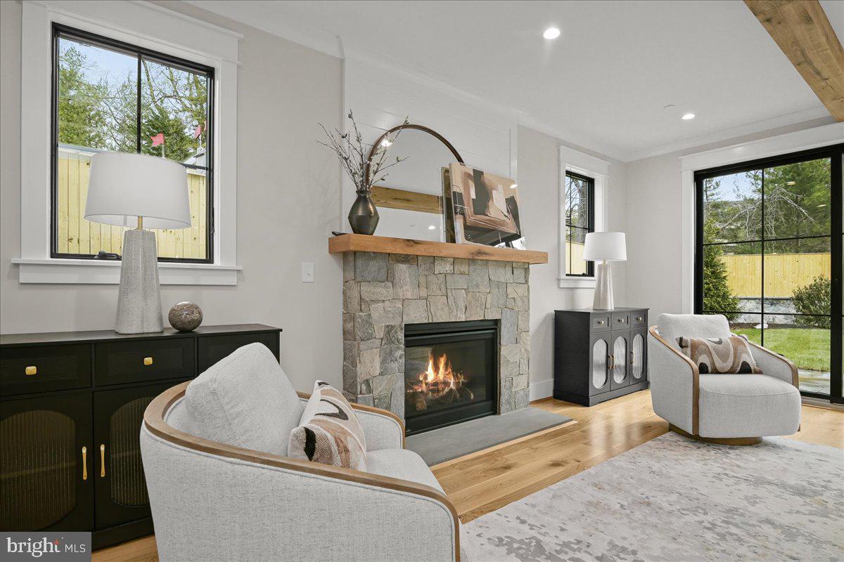204 Oxford Street Chevy Chase, MD 20815 - Photo 11 of 59 a living room with furniture and a fireplace