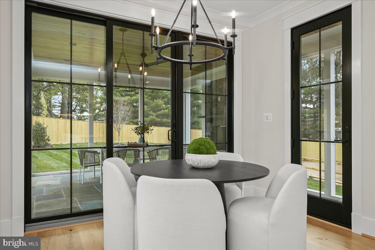 204 Oxford Street Chevy Chase, MD 20815 - Photo 21 of 59 a dining room with glass door and glass windows