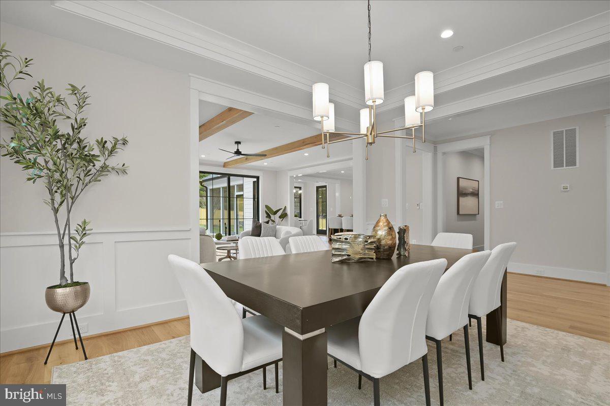 204 Oxford Street Chevy Chase, MD 20815 - Photo 23 of 59 a view of a dining room with furniture wooden floor and chandelier