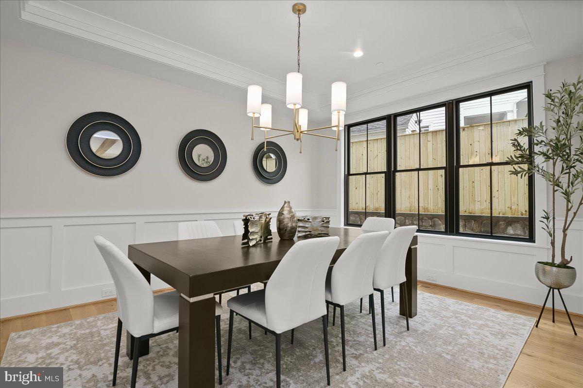 204 Oxford Street Chevy Chase, MD 20815 - Photo 24 of 59 a view of a dining room that has a table and a chair in it