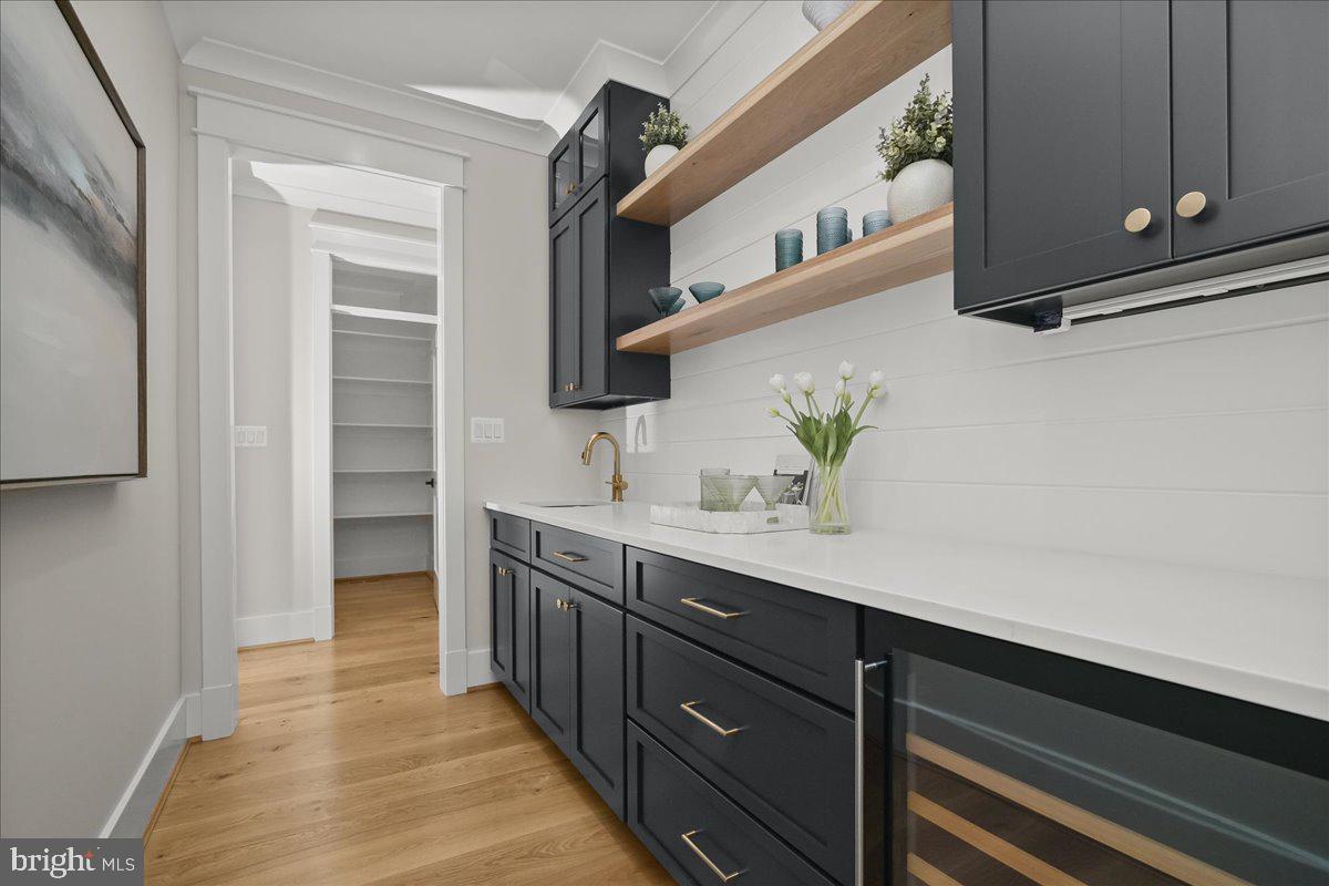 204 Oxford Street Chevy Chase, MD 20815 - Photo 26 of 59 a kitchen with a sink and cabinets