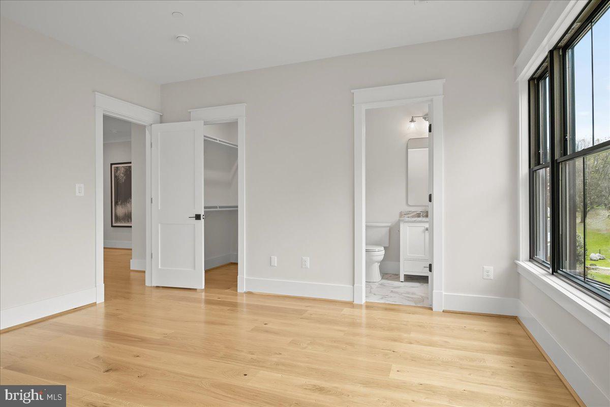204 Oxford Street Chevy Chase, MD 20815 - Photo 45 of 59 a view of an empty room with window and wooden floor