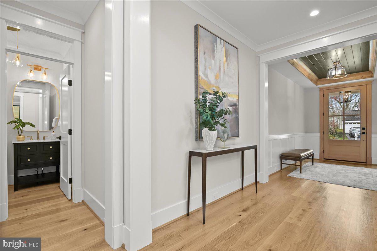 204 Oxford Street Chevy Chase, MD 20815 - Photo 5 of 59 a view of an entryway with wooden floor and a window