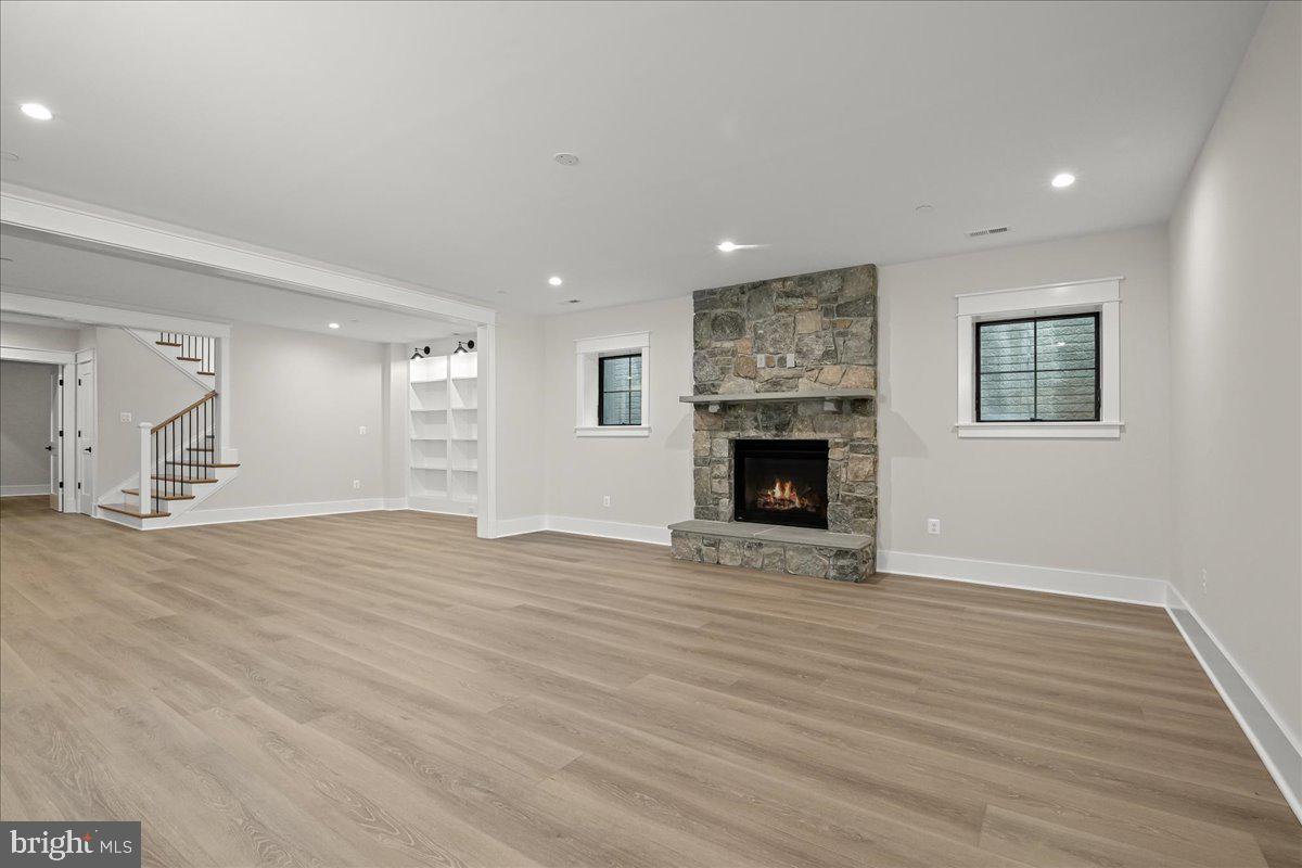 204 Oxford Street Chevy Chase, MD 20815 - Photo 56 of 59 a view of a livingroom with wooden floor and a fireplace