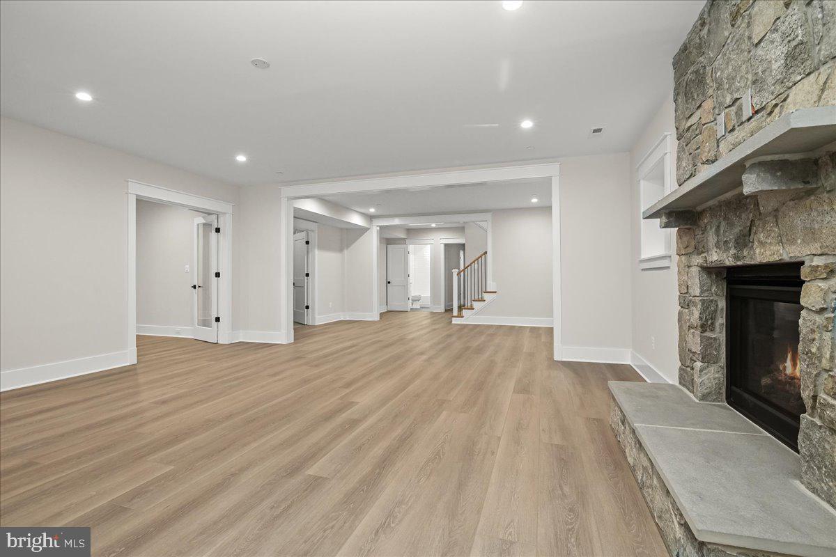 204 Oxford Street Chevy Chase, MD 20815 - Photo 57 of 59 a view of empty room with wooden floor and fireplace