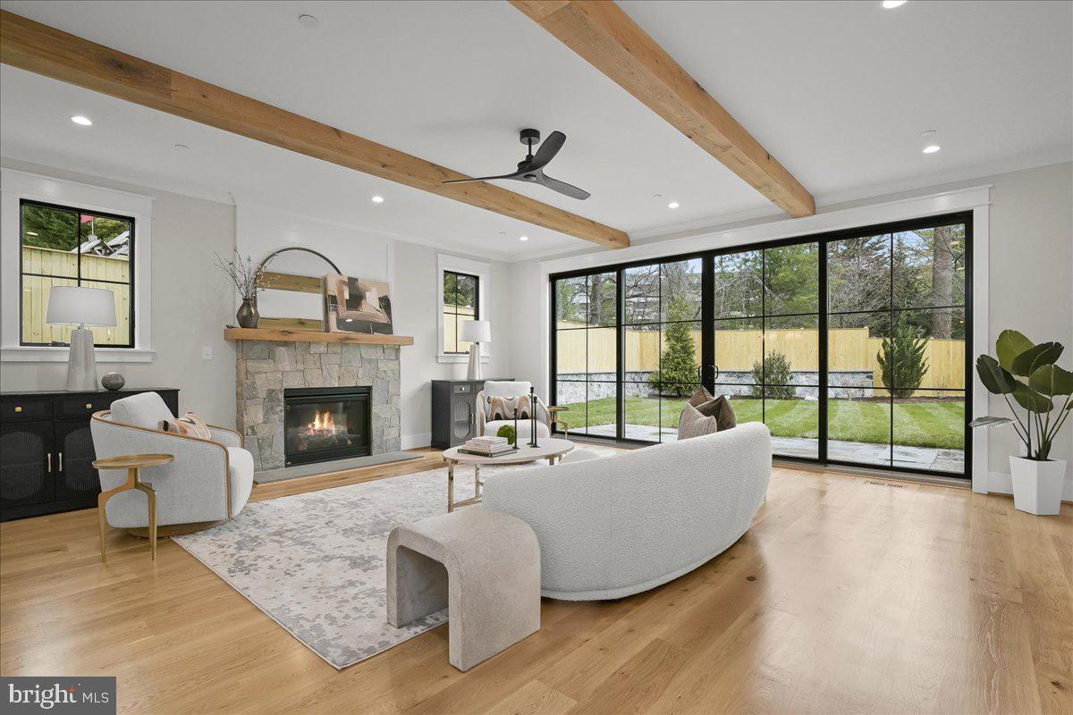 204 Oxford Street Chevy Chase, MD 20815 - Photo 9 of 59 a living room with furniture and a fireplace