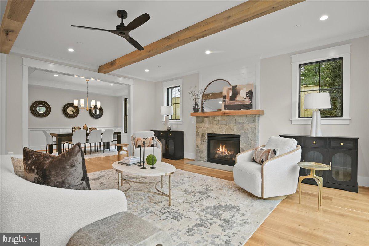 204 Oxford Street Chevy Chase, MD 20815 - Photo 10 of 59 a living room with furniture and a fireplace