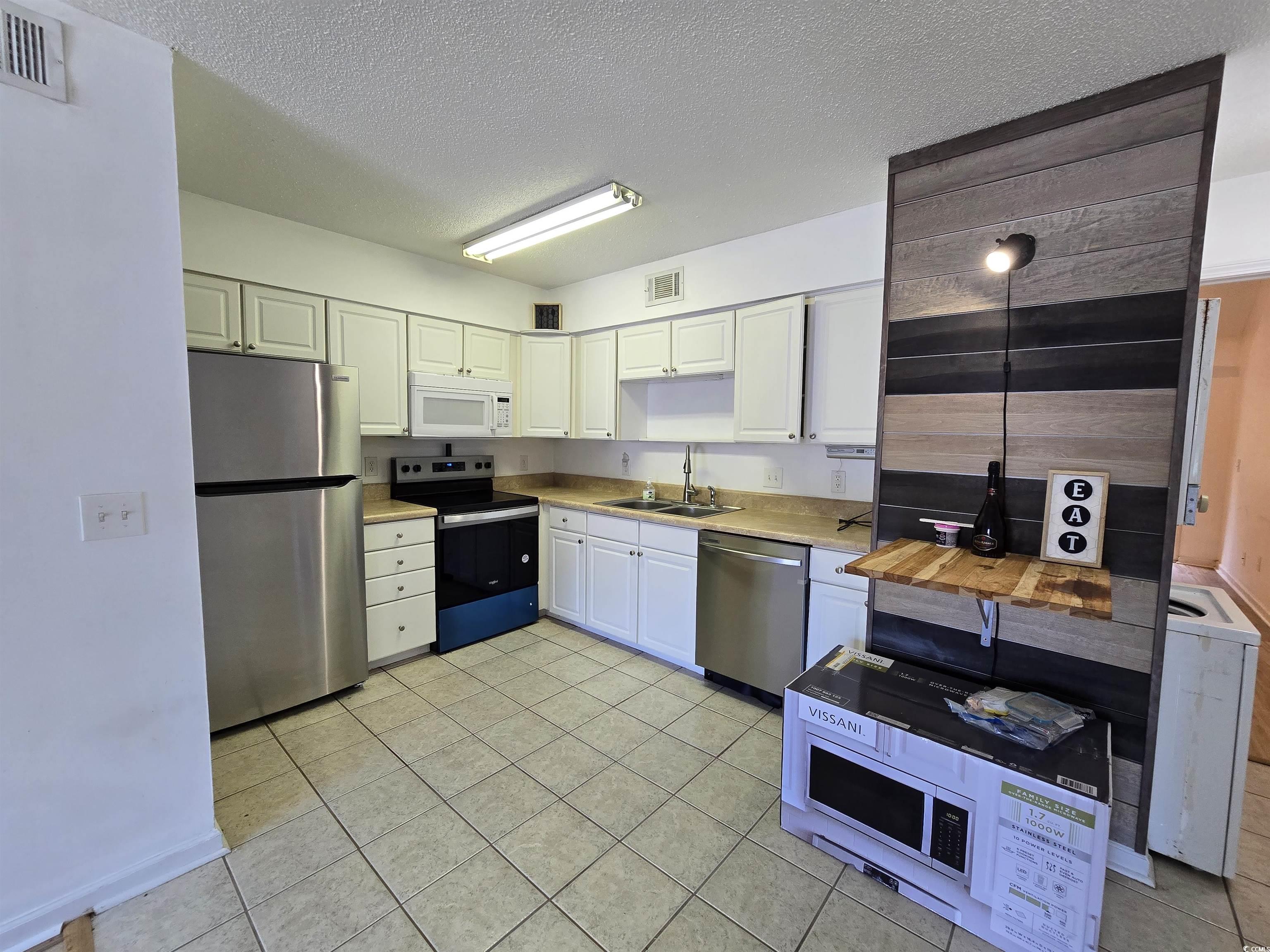F6 Cambridge Circle, Unit F6 Murrells Inlet, SC 29576 - Photo 6 of 15 Kitchen featuring light tile patterned flooring, a